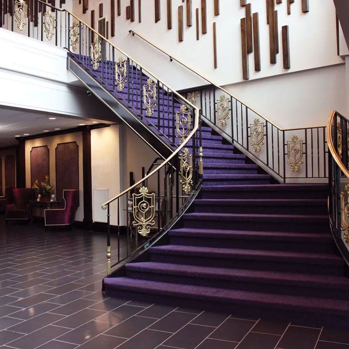 Purple staircase and purple chairs at Royal Regency Hotel in Yonkers, NY