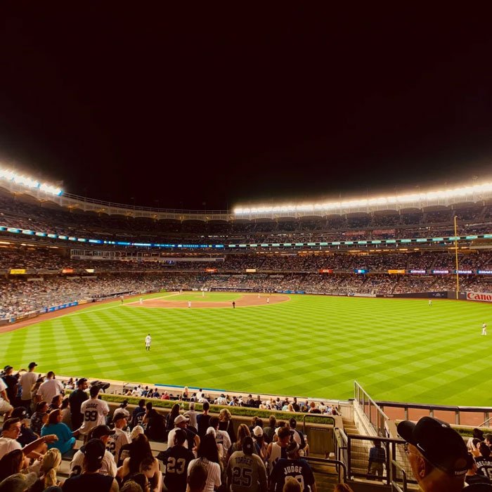 A view from inside Yankee Stadium at night during a baseball game in Yonkers, NY