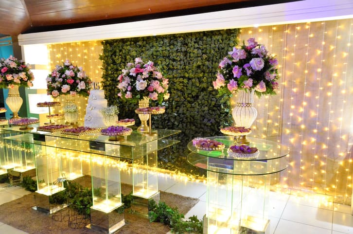 Quinceañera event with tables, floral arrangements, and warm fairy lights in Yonkers, NY